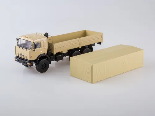 777.101623 Игрушка - Масштабная Модель; КАМАЗ-43118 бортовой с тентом в мягкой упаковке КАМАЗ-УВК3